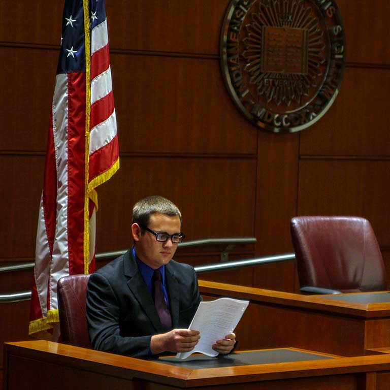 Logan Bromm sits on the bench during a mock trial.