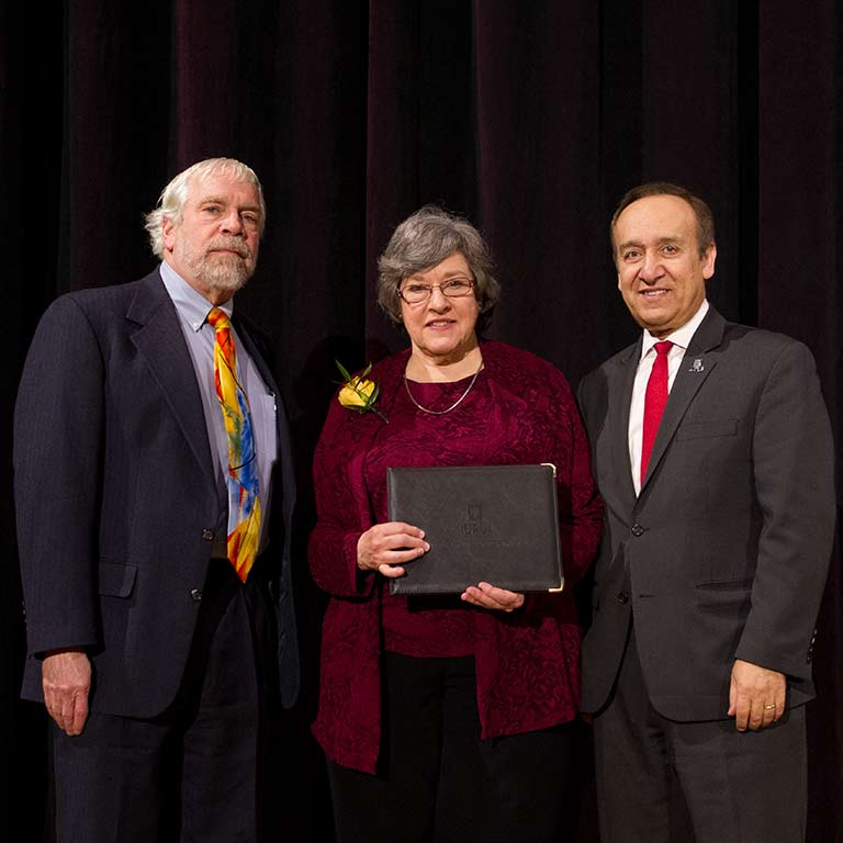 Claudia Dille with former Dean of University Library David Lewis and IUPUI Chancellor Nasser Paydar when she was honored at the 2018 Spirit of Philanthropy Luncheon.