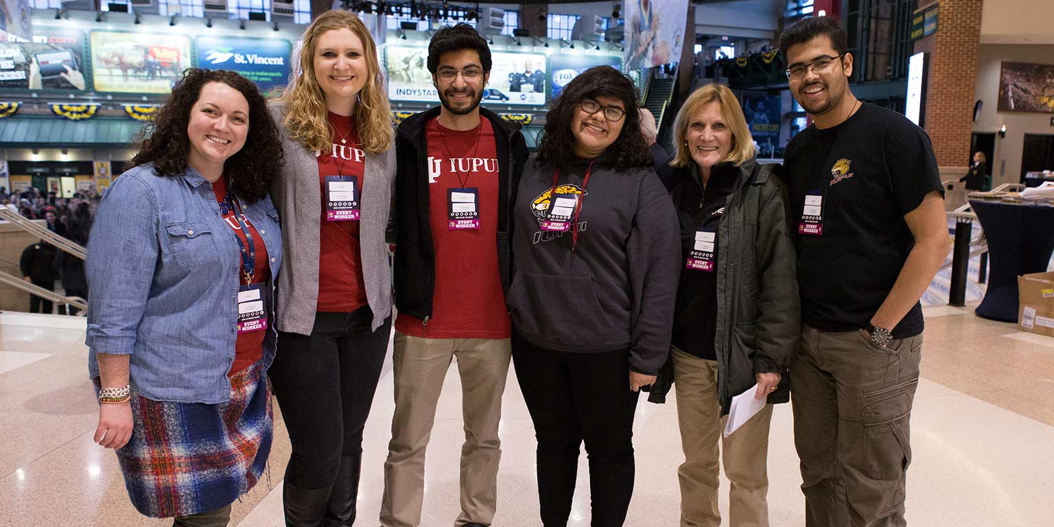 Cindy Harkness with some students at the 2016 IUPUI Night at the Indiana Pacers.