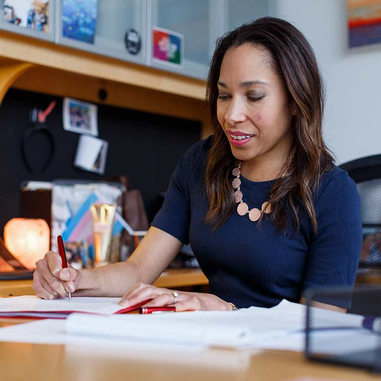 Shannon McCullough works at her desk.