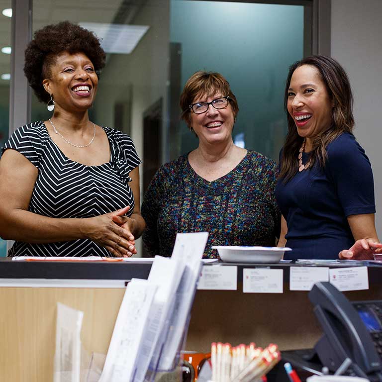 Shannon McCullough chats with some colleagues.