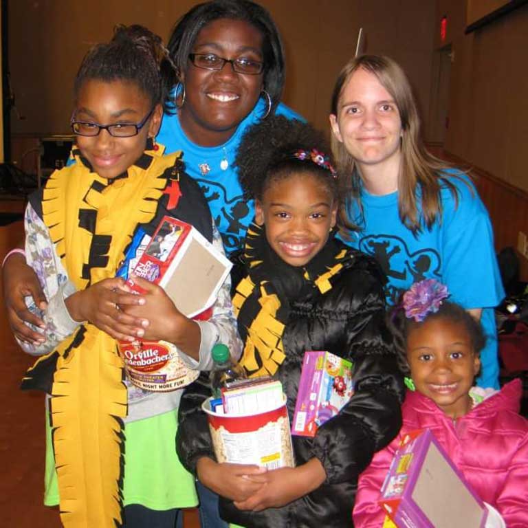 Taylor Rhodes poses with some kids at Jagathon