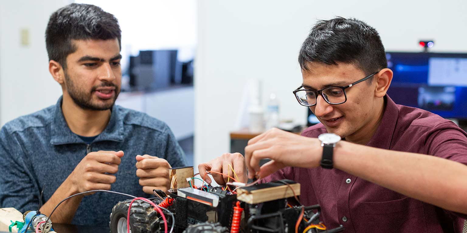 Sohin works on a prototype with a classmate.