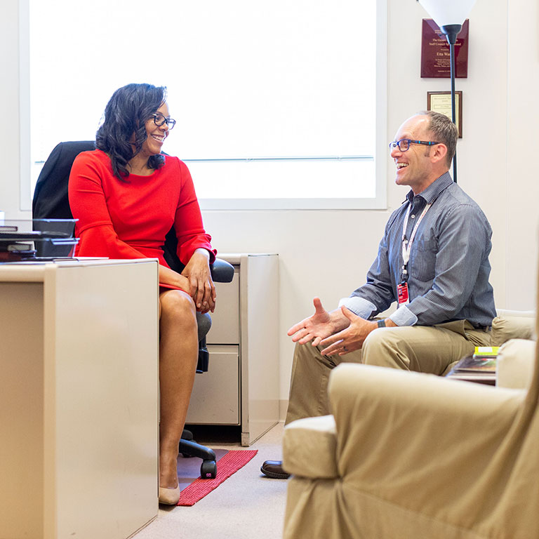 Etta Ward chats with colleague and friend Stephan Viehweg.